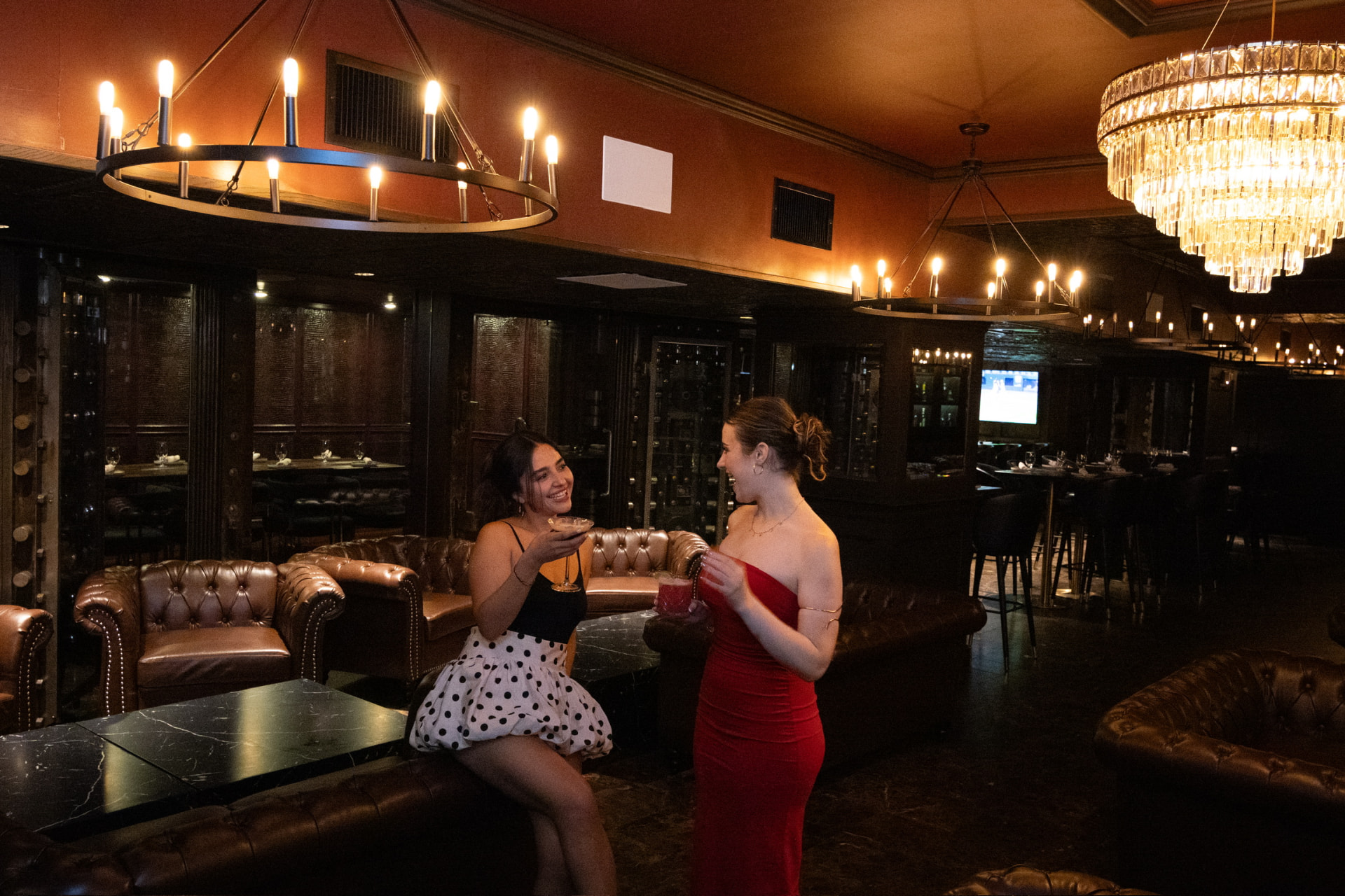 Guests enjoying cocktails together in the Bueno lounge