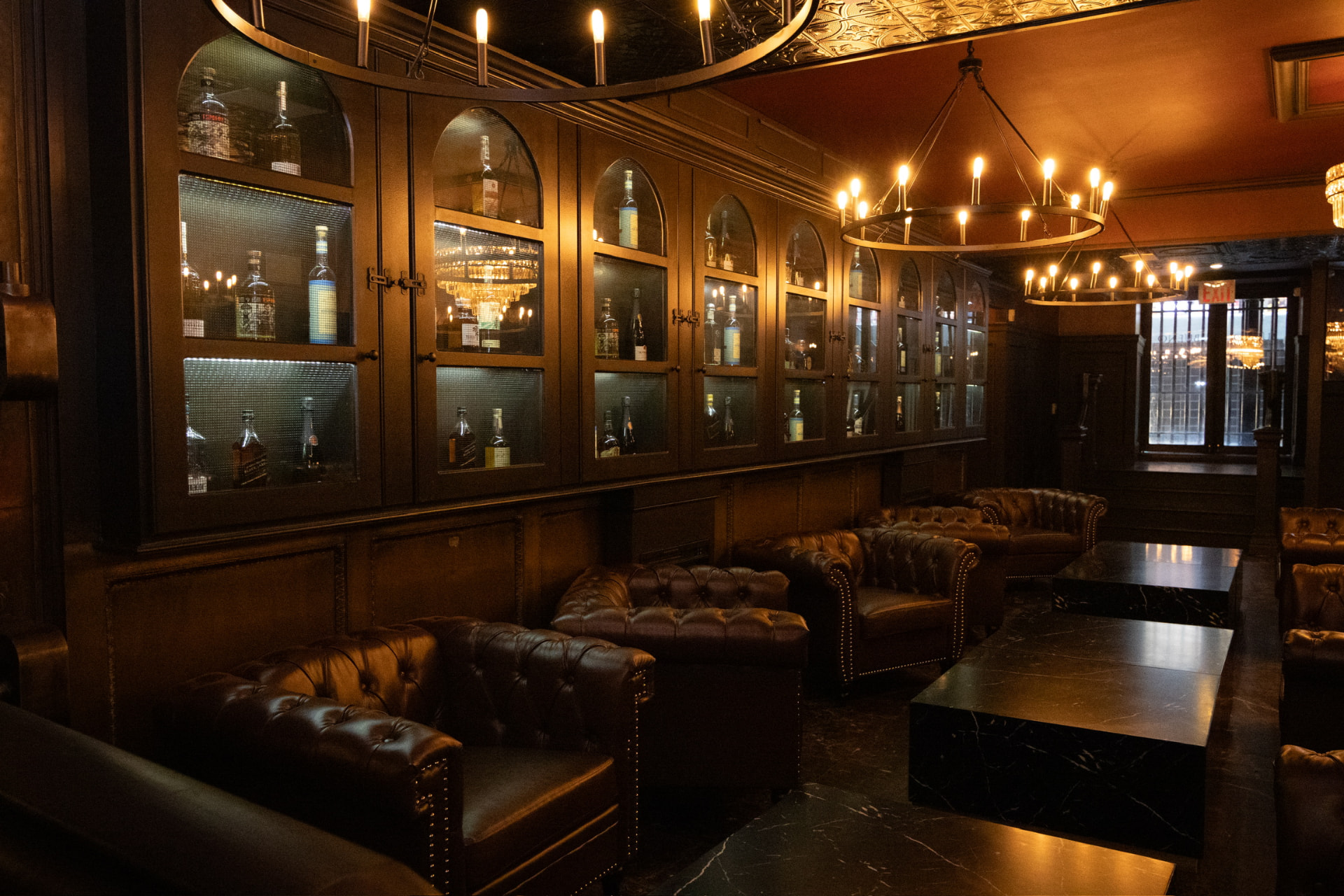 Leather sofas and illuminated spirits cabinets in the Bueno lounge